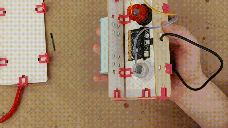 a short video clip showing the battery pack getting secured using four littleBits feet